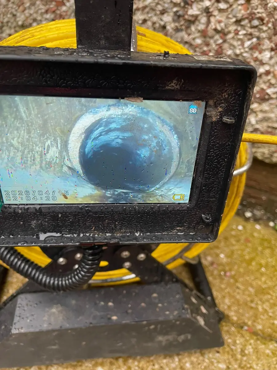 Survey camera monitor showing the inside of a drain pipe
